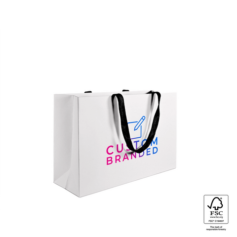 Image of White paper bag with black text and handles on a white background
