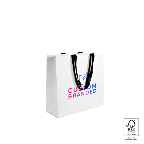Image of White paper bag with black text and handles on a white background