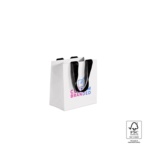 Image of White paper bag with black text and handle on a white background