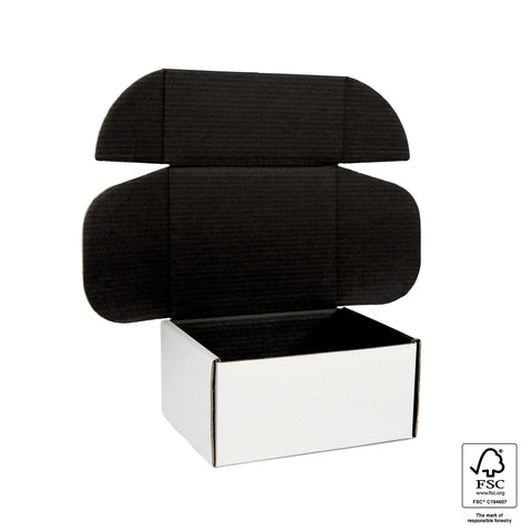 empty white and black medium mailing box