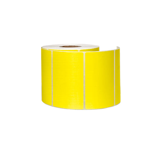 Yellow thermal labels roll on white background.