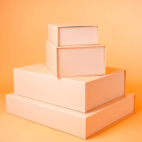 Pile of peach magnetic gift boxes | NEON packaging