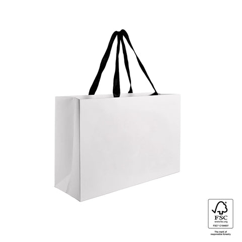 Image of White paper bag with black handles on a white background, featuring FSC certification logo.
