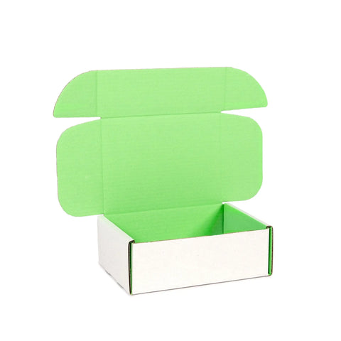 Empty small mailing boxes pastel green