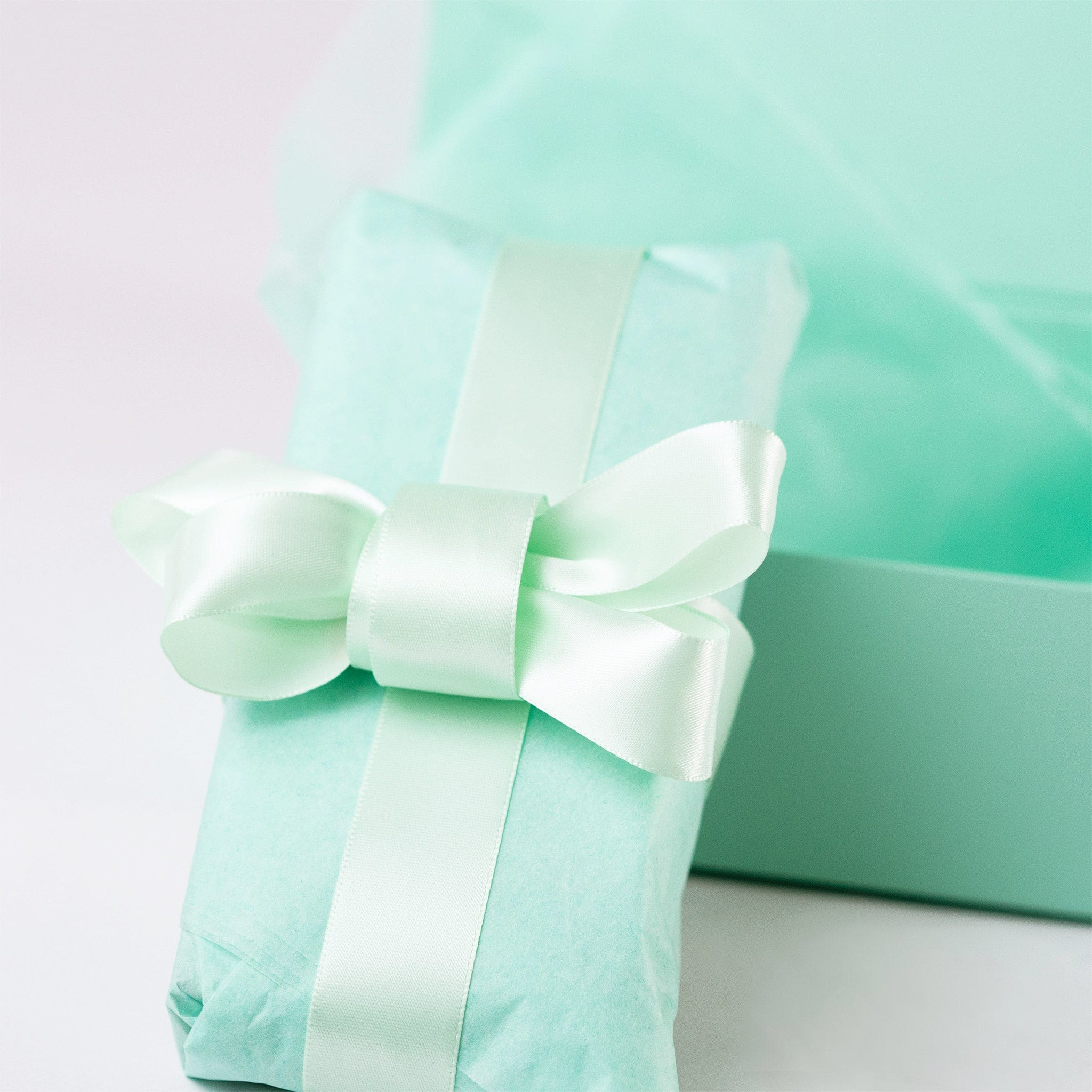 Wrapping the  item with our NEON Acid-Free Tissue Paper - Mint Green with Satin ribbon 