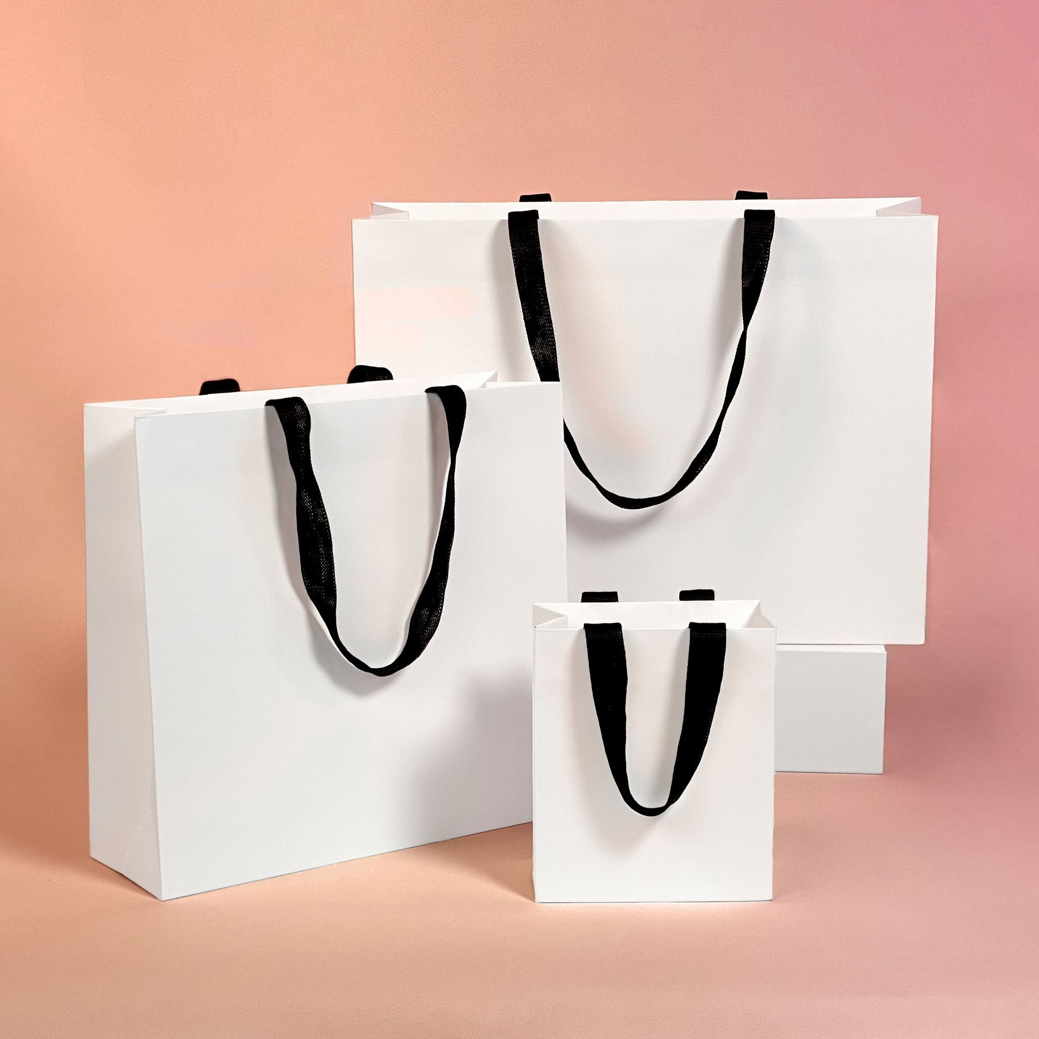 all sizes of white paper bags
